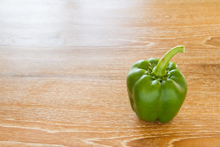 sweet pepper on wooden tableの写真素材