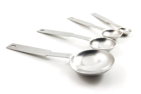 measuring spoons isolated on white backgroundの写真素材