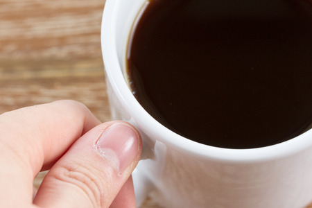 cup of coffee on wooden backgroundの写真素材
