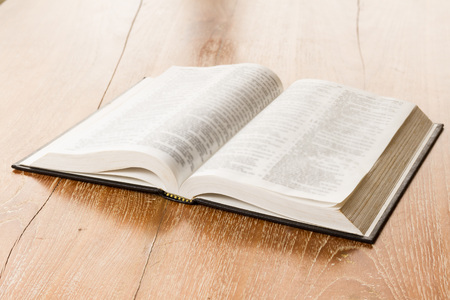 open book on wooden background