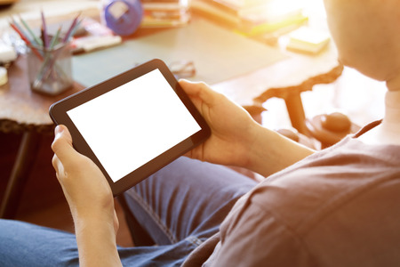 man using mobile tablet computer with blank white screen