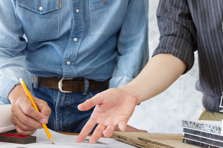 engineer meeting and discuss for architectural project plan on table in officeの写真素材