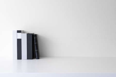 Mockup office desk workspace with books on white background. Front view with copy space.の写真素材