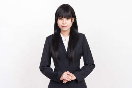 asian business woman with welcome stand isolated on white backgroundの写真素材
