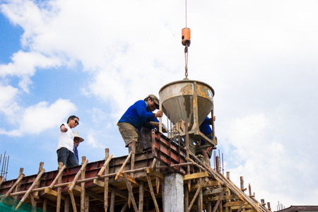 NAKHONRATCHASIMA, THAILAND - DECEMBER 24, 2015: Construction concrete floor beams using a crane....