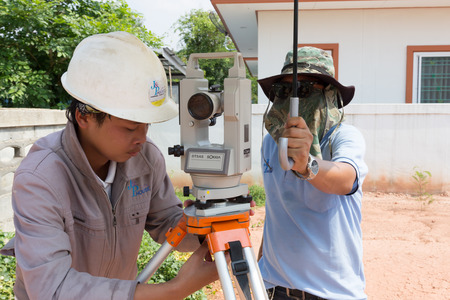 NAKHONRATCHASIMA, THAILAND - MAY 3, 2016: Man survey checking before housing construction site NAKHONRATCHASIMA THAILAND.のeditorial素材