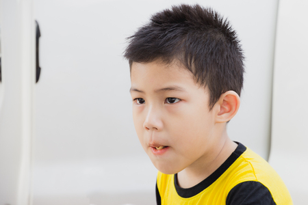portrait asian little boy like eat snacksの写真素材