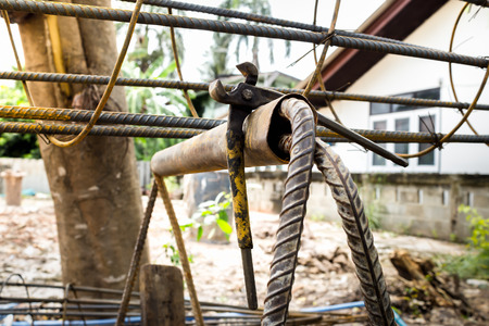 Construction site use pincers tool on wire steel bar