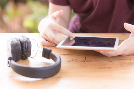 asia girl happy learning song on tablet and headphonesの写真素材