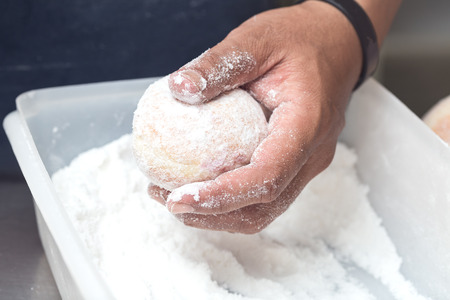 business bakery closeup hand work icing donut jam background