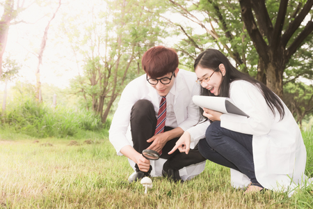 People research studying nature and with notebookの写真素材