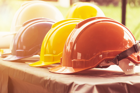 industry work engineer hat on the table in site