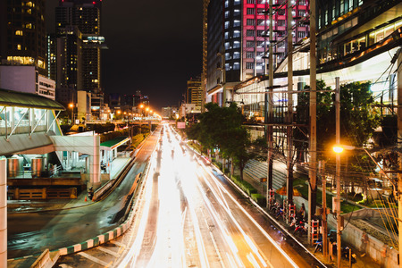 Landmark chong nonsi BTS station at night in background Thailandの写真素材