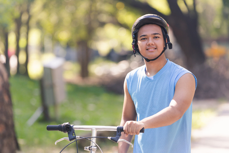 young man riding bicycle in the park ,man lifestyle concept sportの写真素材