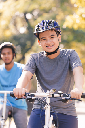 young man riding bicycle in the park ,man lifestyle concept sportの写真素材