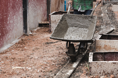 industrial construction labor work concrete mix with cartの写真素材