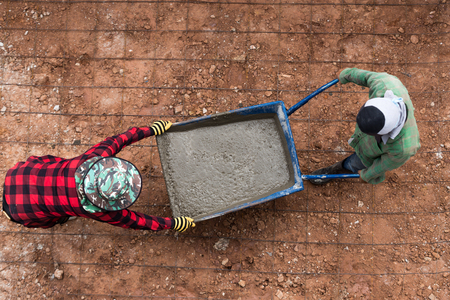industrial construction labor work concrete mix with cart. Top viewの写真素材