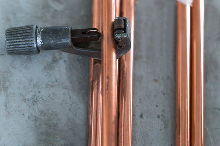 Industry system men worker cut joint with tool of copper pipe air conditionerの写真素材