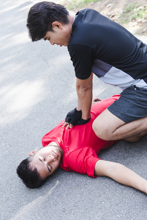 CPR with people with a heart attack in parkの写真素材