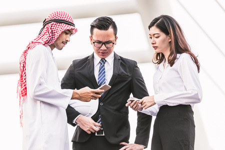 Engineers business men and woman working building plan construction in cityの写真素材