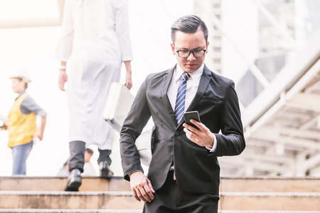 Engineers business men and woman working building plan construction in cityの写真素材