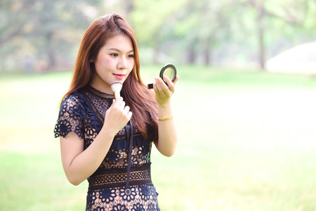 Beautiful asian women make up on face ,Natural backgroundの写真素材