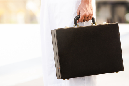 Closeup Business men handle hold Document bag black colorの写真素材