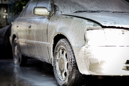 Car washing cleaning,Cleaning car using high pressure  spray foamの写真素材