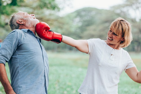 Senior woman smiling active boxing punching old men,Senior couple conceptの写真素材