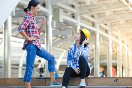 Happy mother teaching her daughter with a dream to become a future engineer.の写真素材