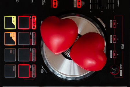 DJ to mix & play music on Turntable vinyl record playerの写真素材