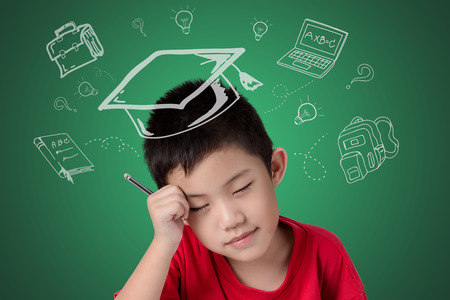 Back to school asia little boy holding pencil think of the future , Education kids concept