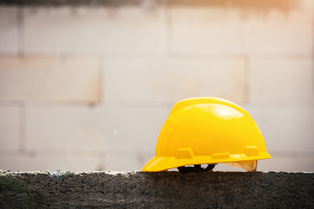 Construction safety helmet hanging,Hat yellow Safety Engineerの写真素材
