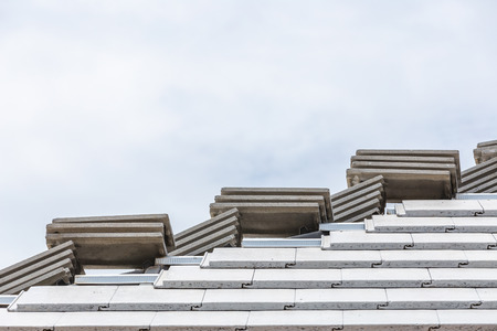 Tile roof concrete gray color under construction with stacks on roof