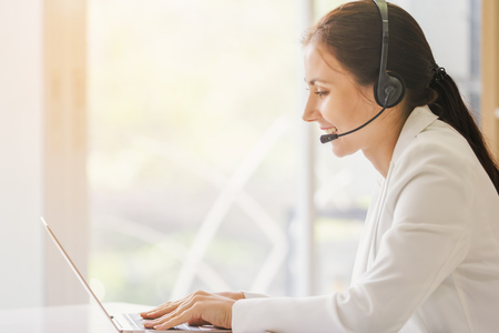 Portrait operator businesswomen smiling customer support female phone worker,copyspace area for slogan or textの写真素材