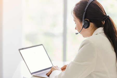 Portrait operator businesswomen smiling customer support female phone worker,copyspace area for slogan or textの写真素材