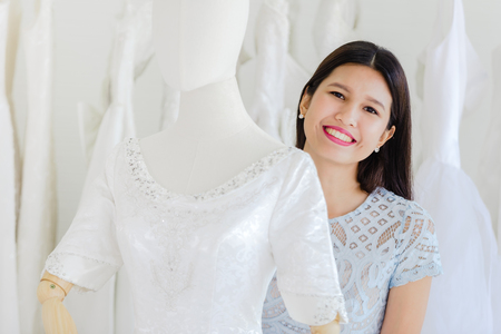 Portrait Asian women cheerful happiness in wedding fashion storeの写真素材