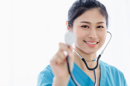 Portrait Doctor woman holding stethescope work standing in room hospitalの写真素材