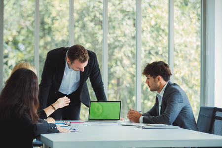 Business team working at modern office,Green scene on laptopの写真素材