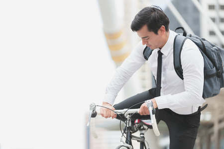Business man worker riding bicycles in city,Concept ecology bike go to workerの写真素材