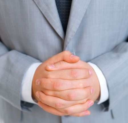 Close up of middle aged business man with fused fingersの写真素材