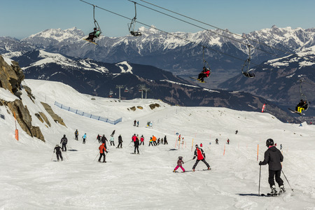 Skiing people, the chair lifts and rope tow systems of Kaprun ski region in Austriaの写真素材