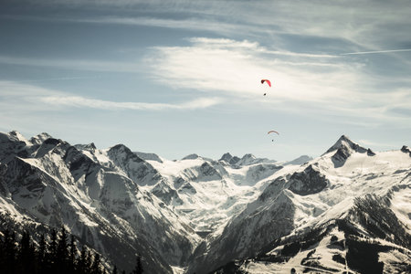 Beautiful mountain landscape with paragliderの写真素材