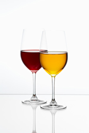 glasses with yellow and red color drink の写真素材