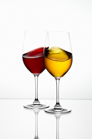 glasses with yellow and red color drink の写真素材