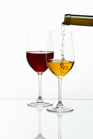glasses with yellow and red color drink の写真素材