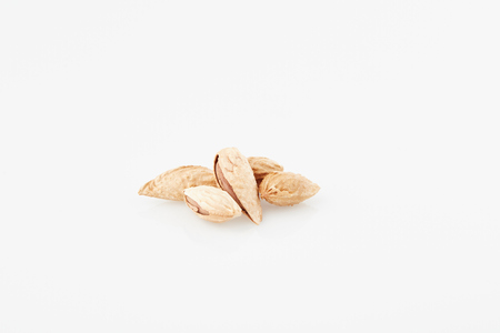 almonds with rind on white fundの写真素材