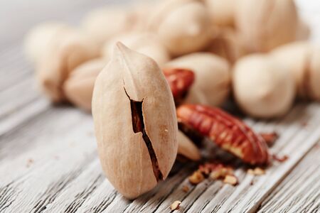 Pecans on a wooden tableの写真素材