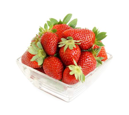 Heap of fresh strawberries in a glass bowl isolated on white background with pathの写真素材