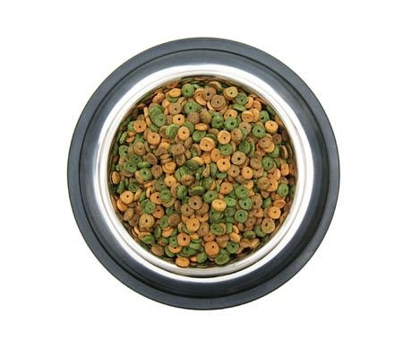 dry pet food in the metal bowl on white background top viewの写真素材
